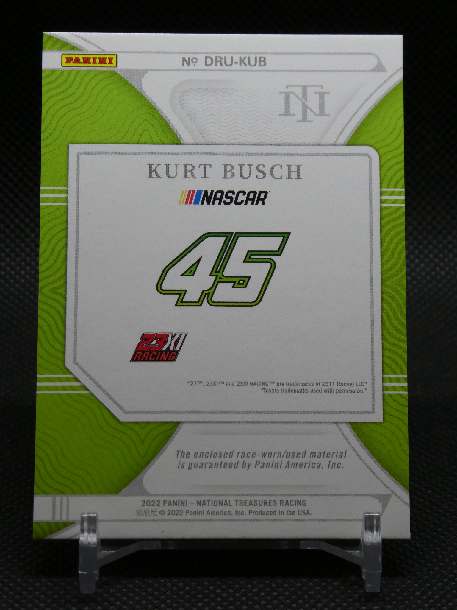 Panini NASCAR Kurt Busch trading card package with a large green 45 logo and 23XI Racing branding on a lime background.
