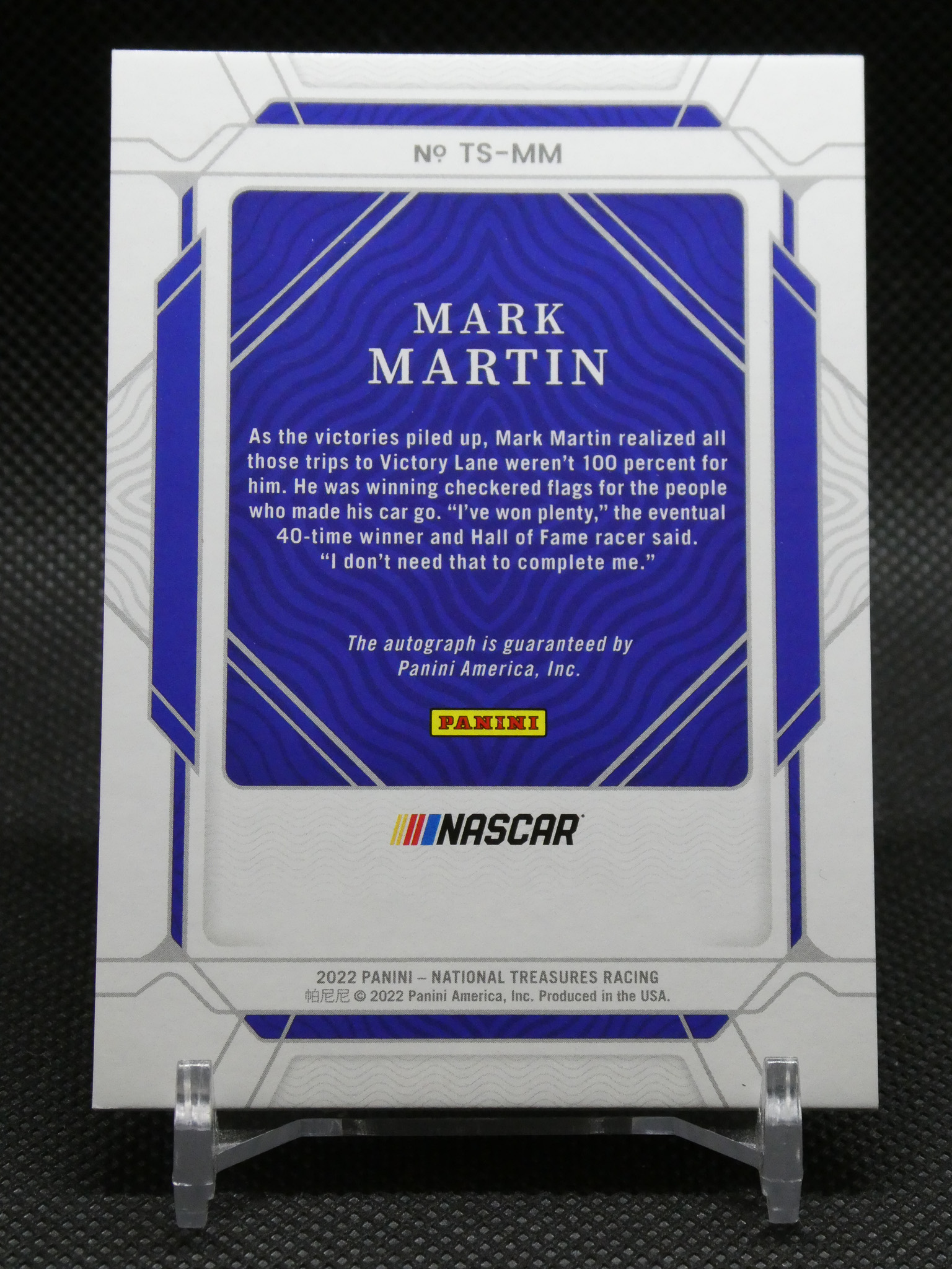 Back of a Panini NASCAR trading card for Mark Martin, blue panel with quote and Panini logo.