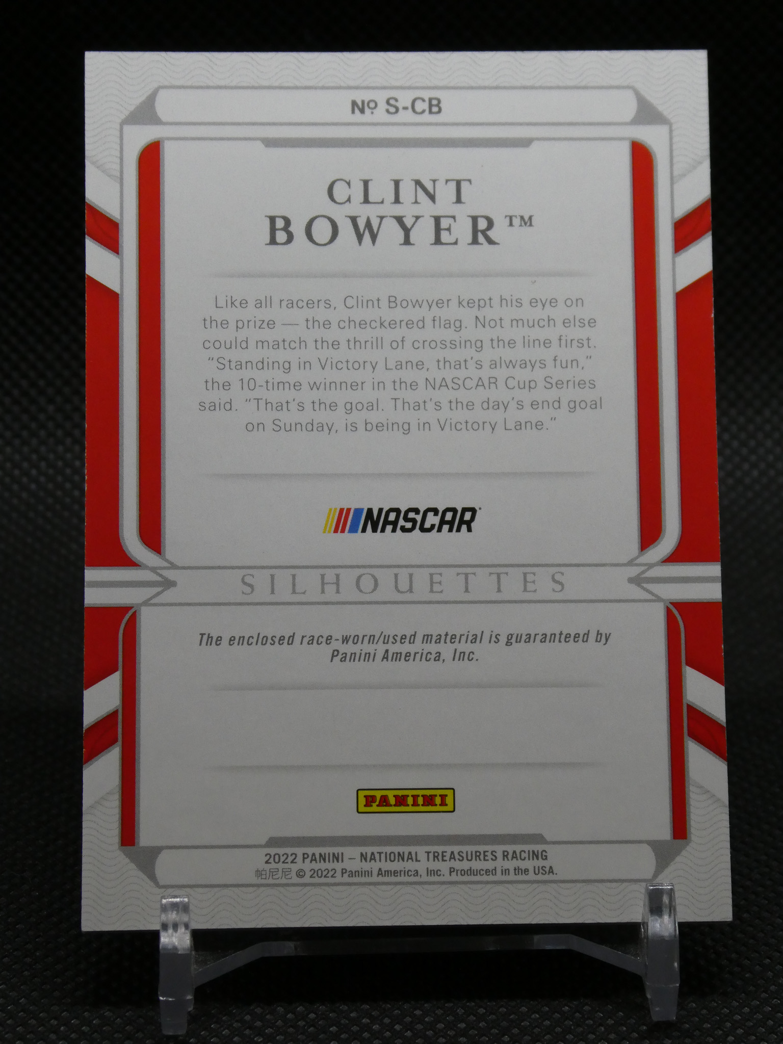 NASCAR Panini Silhouettes card featuring Clint Bowyer with descriptive text and Panini logo on a white/red background.