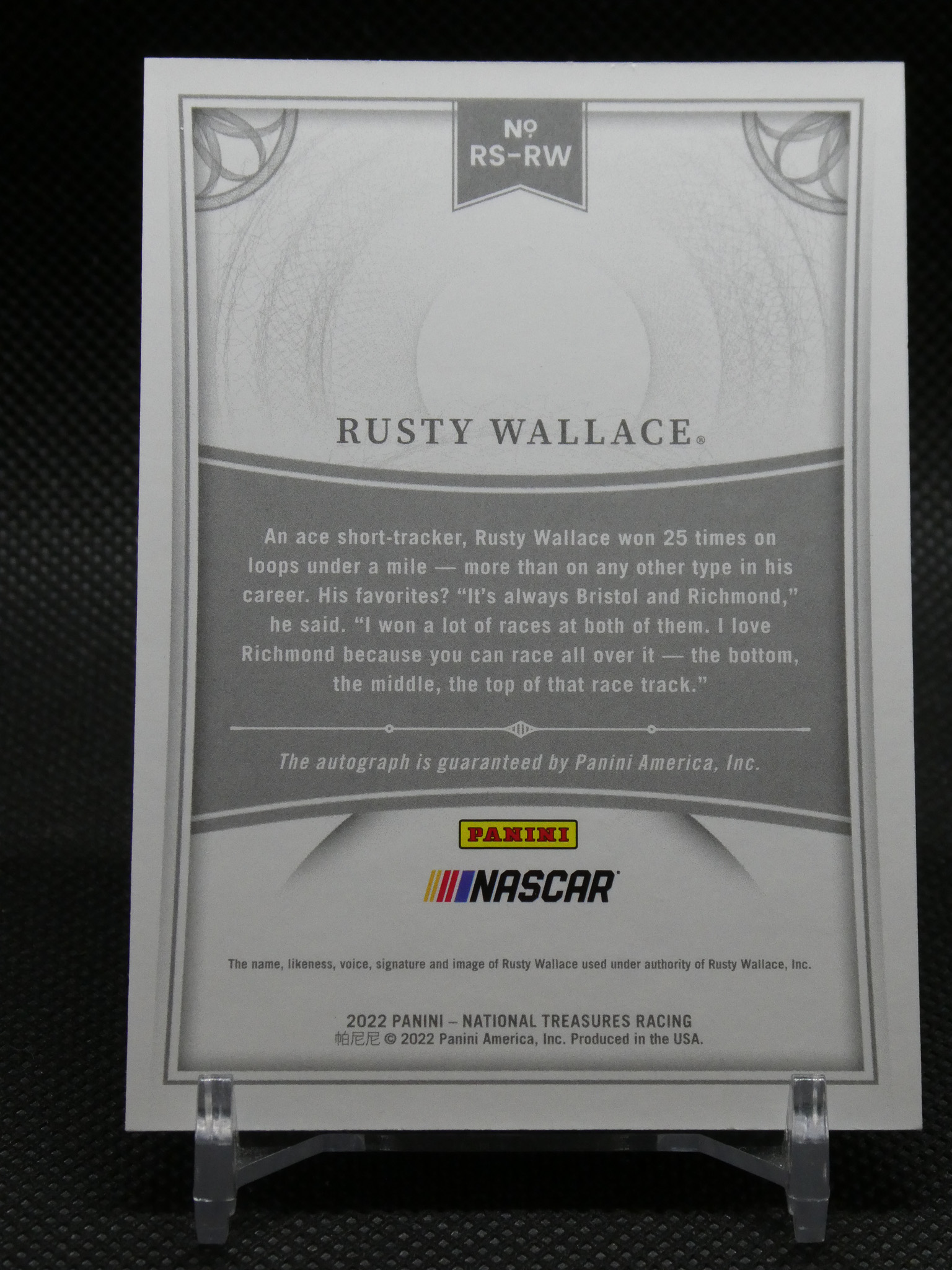 Back of a Rusty Wallace NASCAR trading card with decorative borders and Panini/NASCAR logos.”