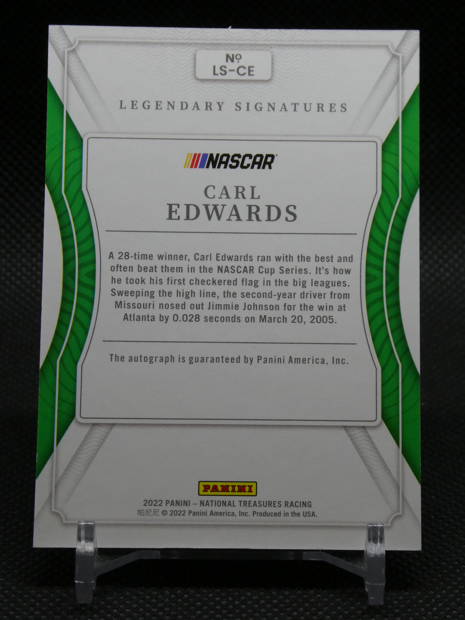 Front of NASCAR Legendary Signatures card for Carl Edwards, featuring green border, Panini logo, and text about his Cup Series wins (autograph included).