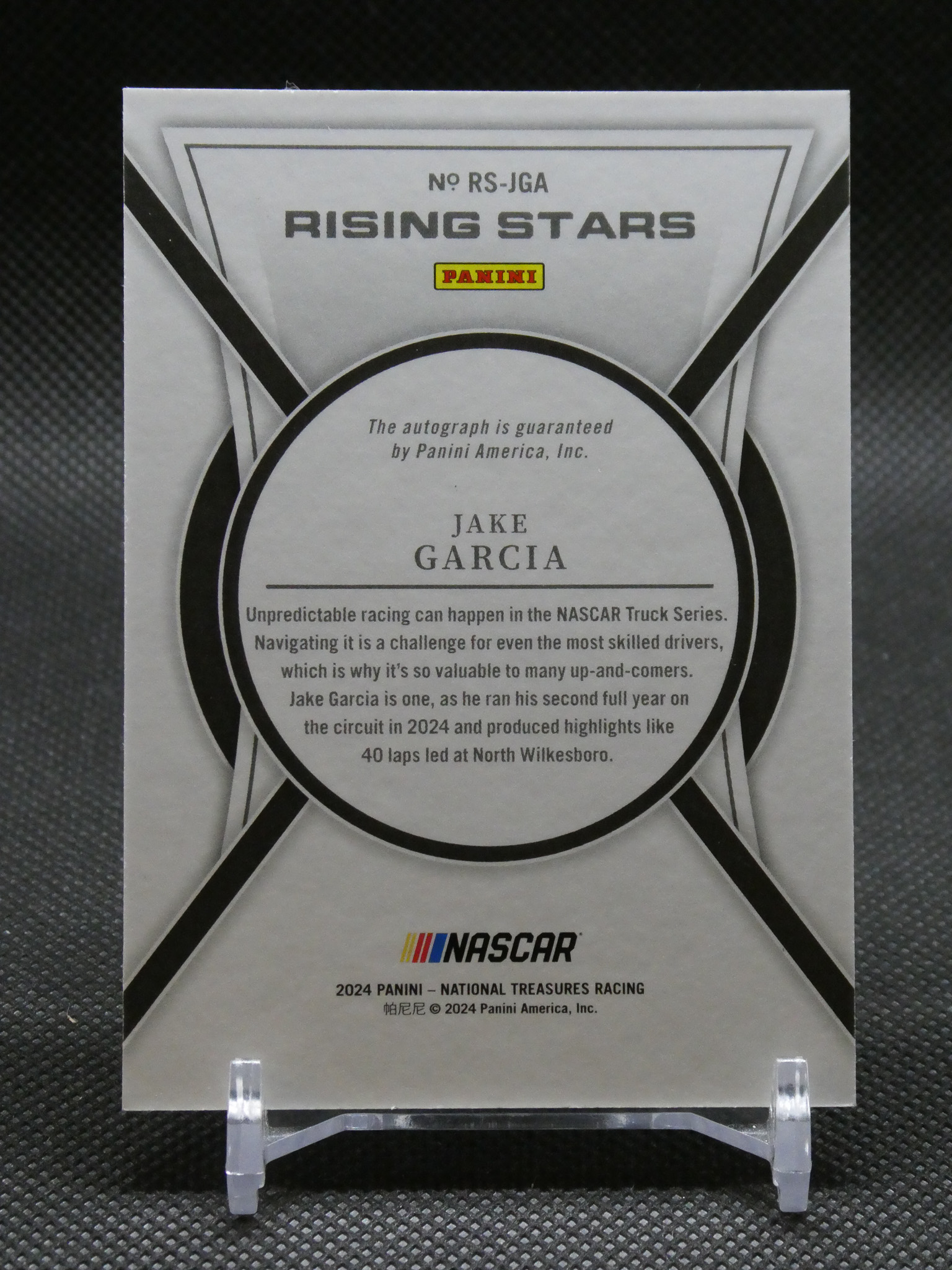 Panini Rising Stars NASCAR trading card featuring Jake Garcia with circular centerpiece and guaranteed autograph by Panini America