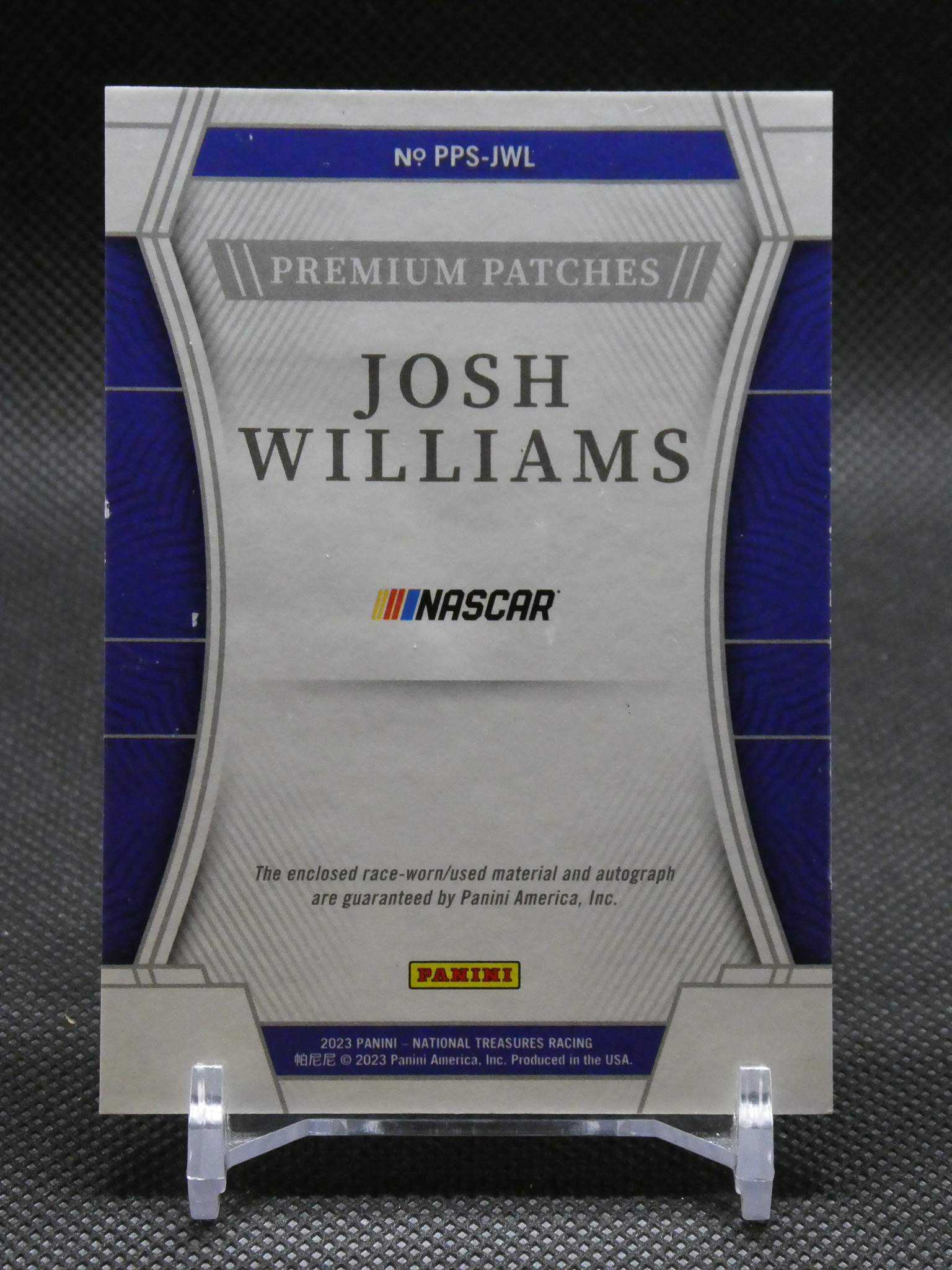 Panini NASCAR trading card front featuring Josh Williams and the NASCAR logo in a silver-blue design on a stand.