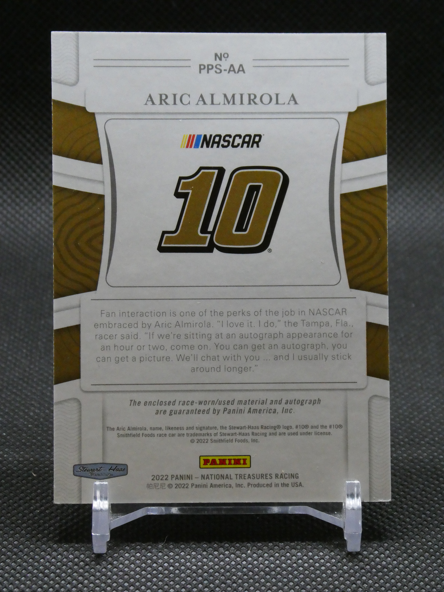 NASCAR trading card showing Aric Almirola's name and the number 10 (Panini label visible).