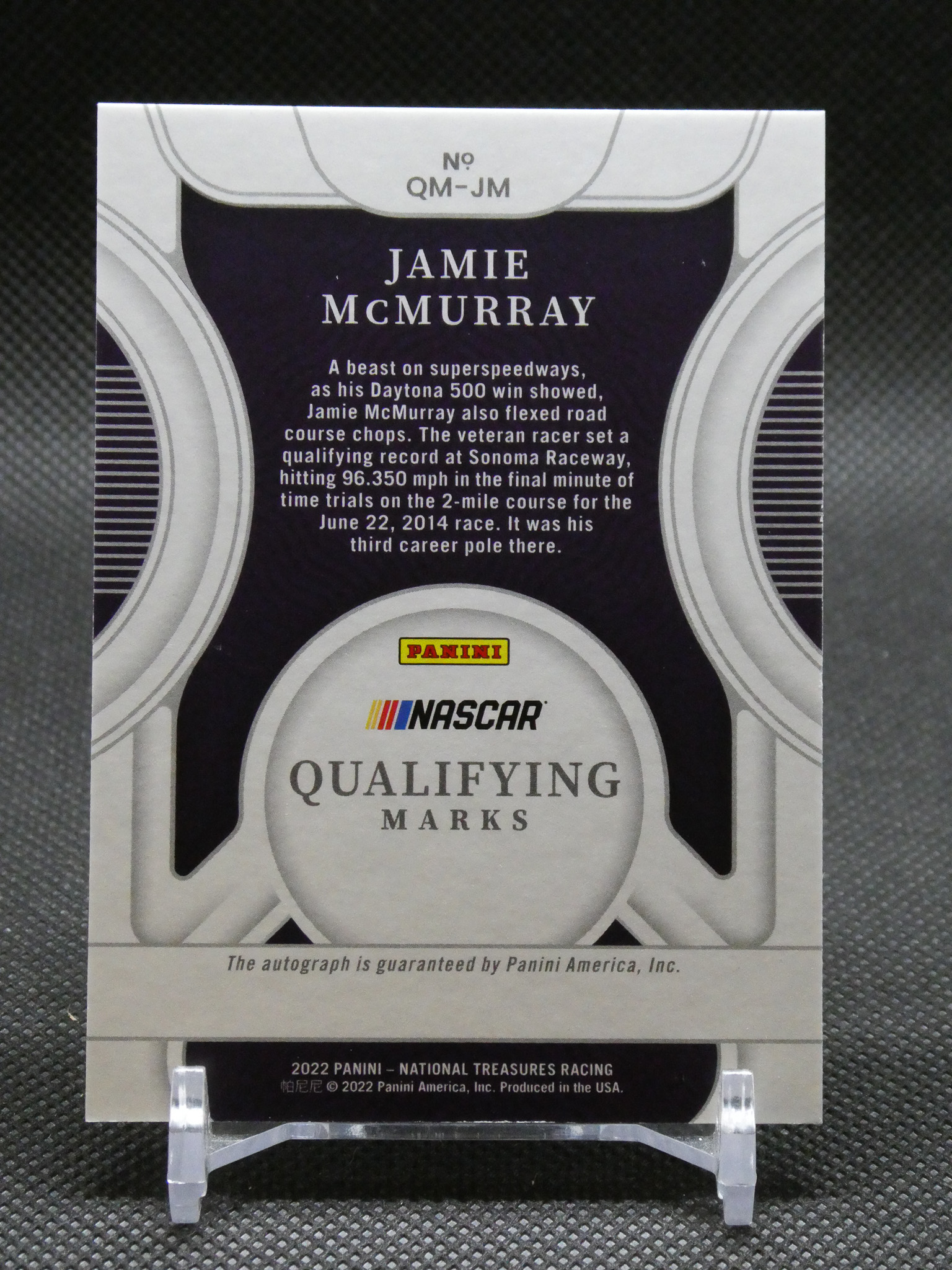Back of a Panini NASCAR qualifying marks card featuring Jamie McMurray, with the bio paragraph and Panini logo visible, plus NASCAR branding.