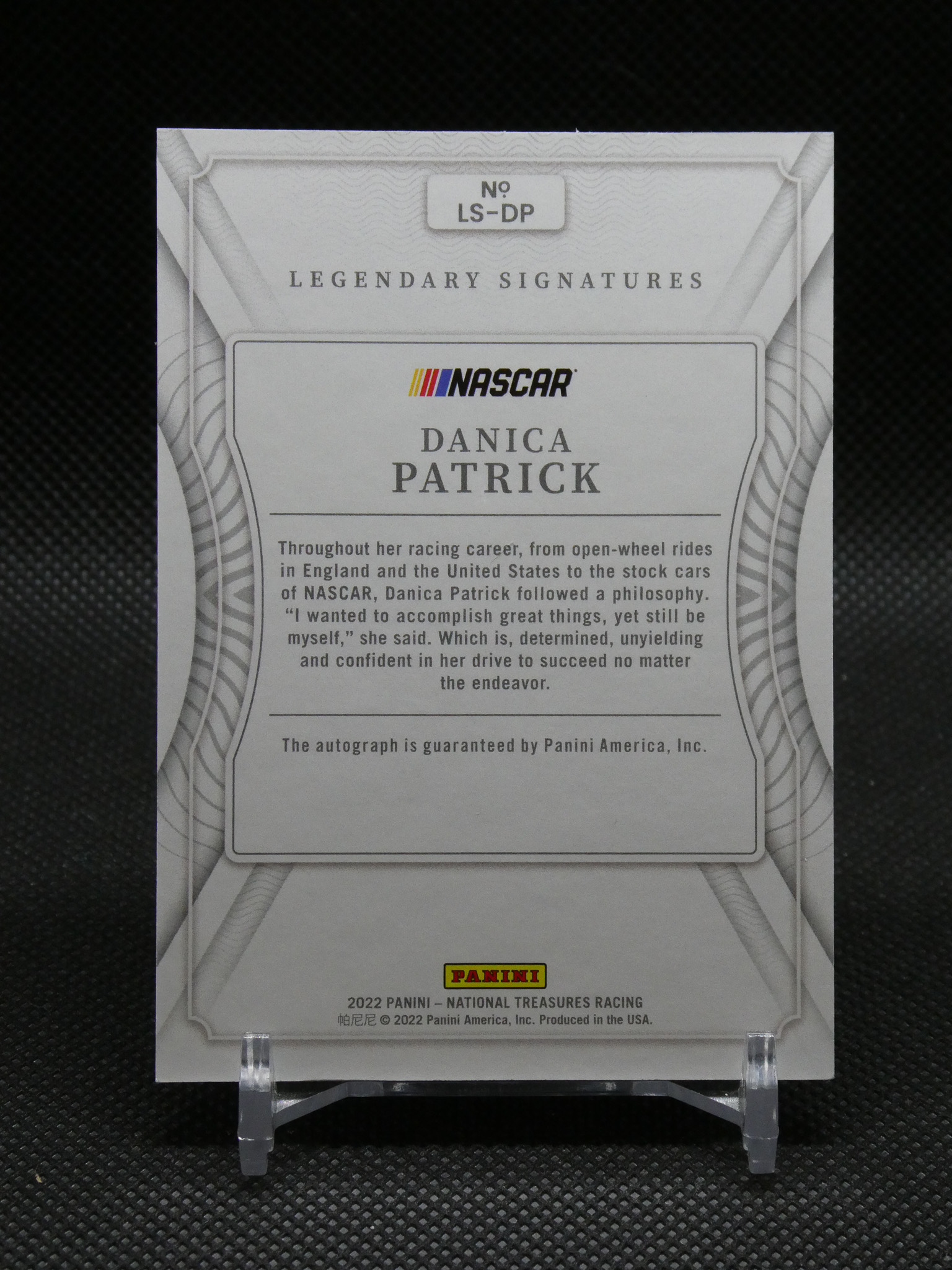 Autographed NASCAR card featuring Danica Patrick, framed with decorative borders and Panini logo.