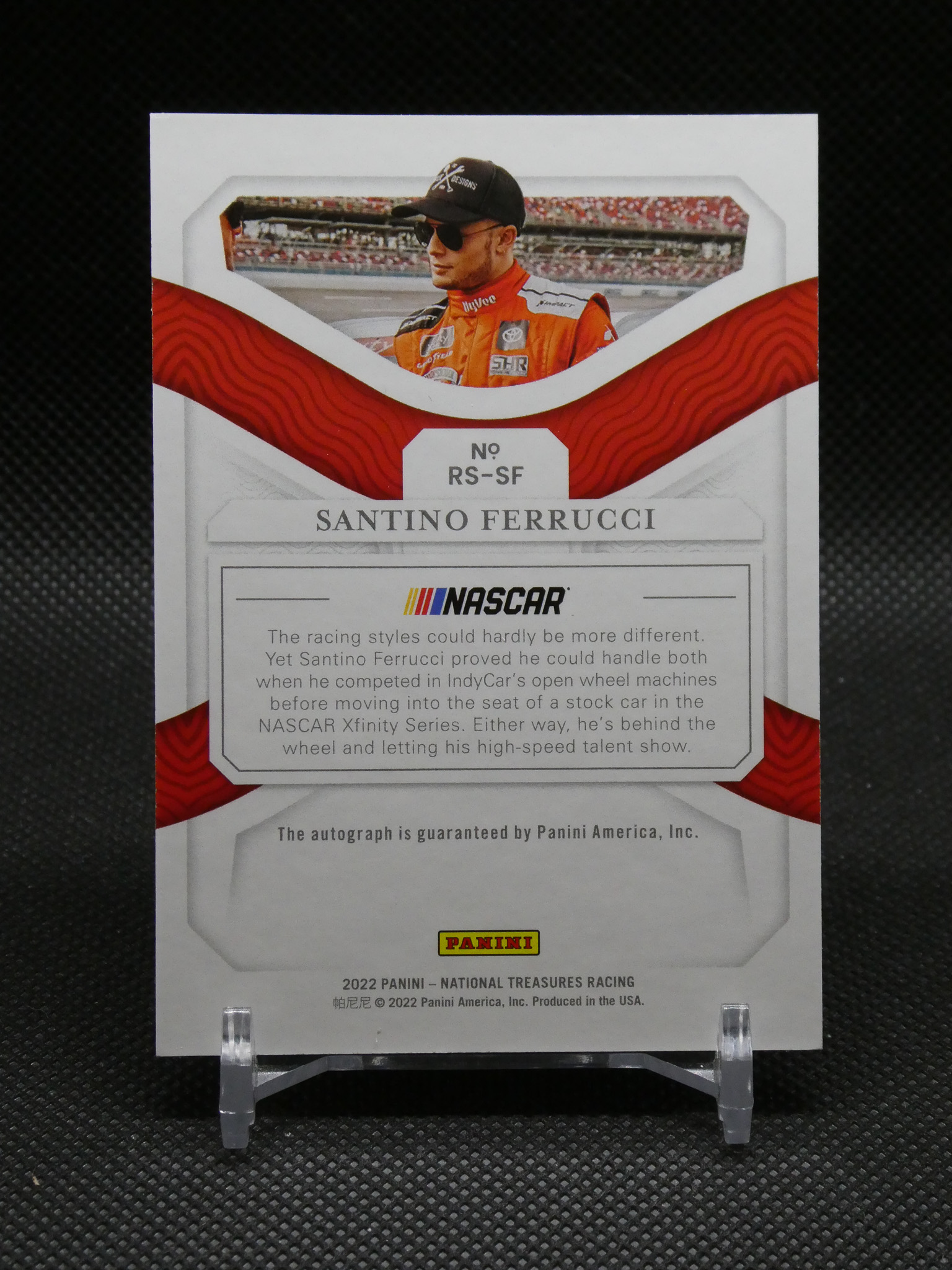 NASCAR trading card featuring driver Santino Ferrucci in a red racing suit, with his name and No. RS-SF visible and Panini branding at the bottom.