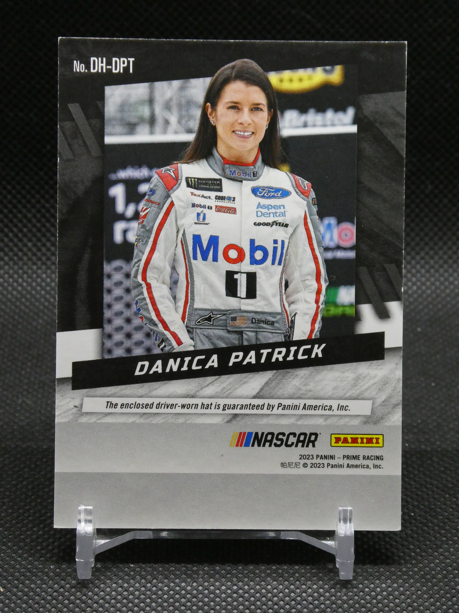 Danica Patrick NASCAR trading card showing her in a white Mobil racing suit with sponsor logos and her name at the bottom.