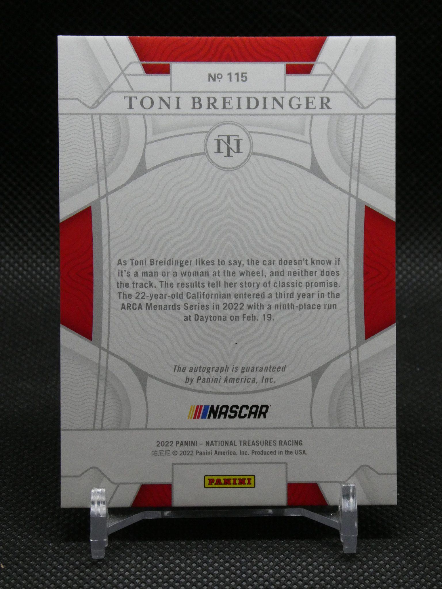 Back of a Panini NASCAR trading card featuring Toni Breidinger, with a silver geometric design and red accents, plus Panini and NASCAR logos at the bottom.