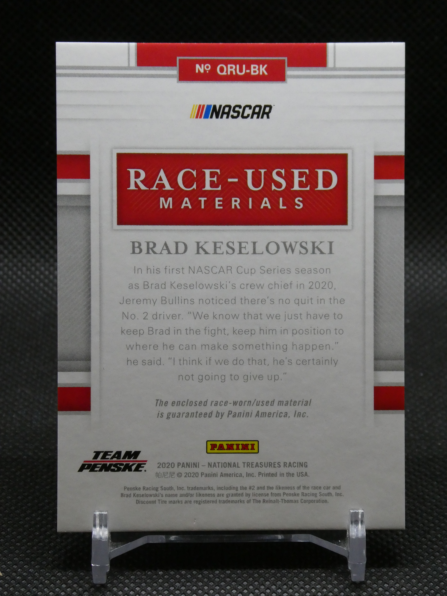 Display card titled 'Race-Used Materials' from NASCAR/PANINI, featuring Brad Keselowski and Team Penske memorabilia text.