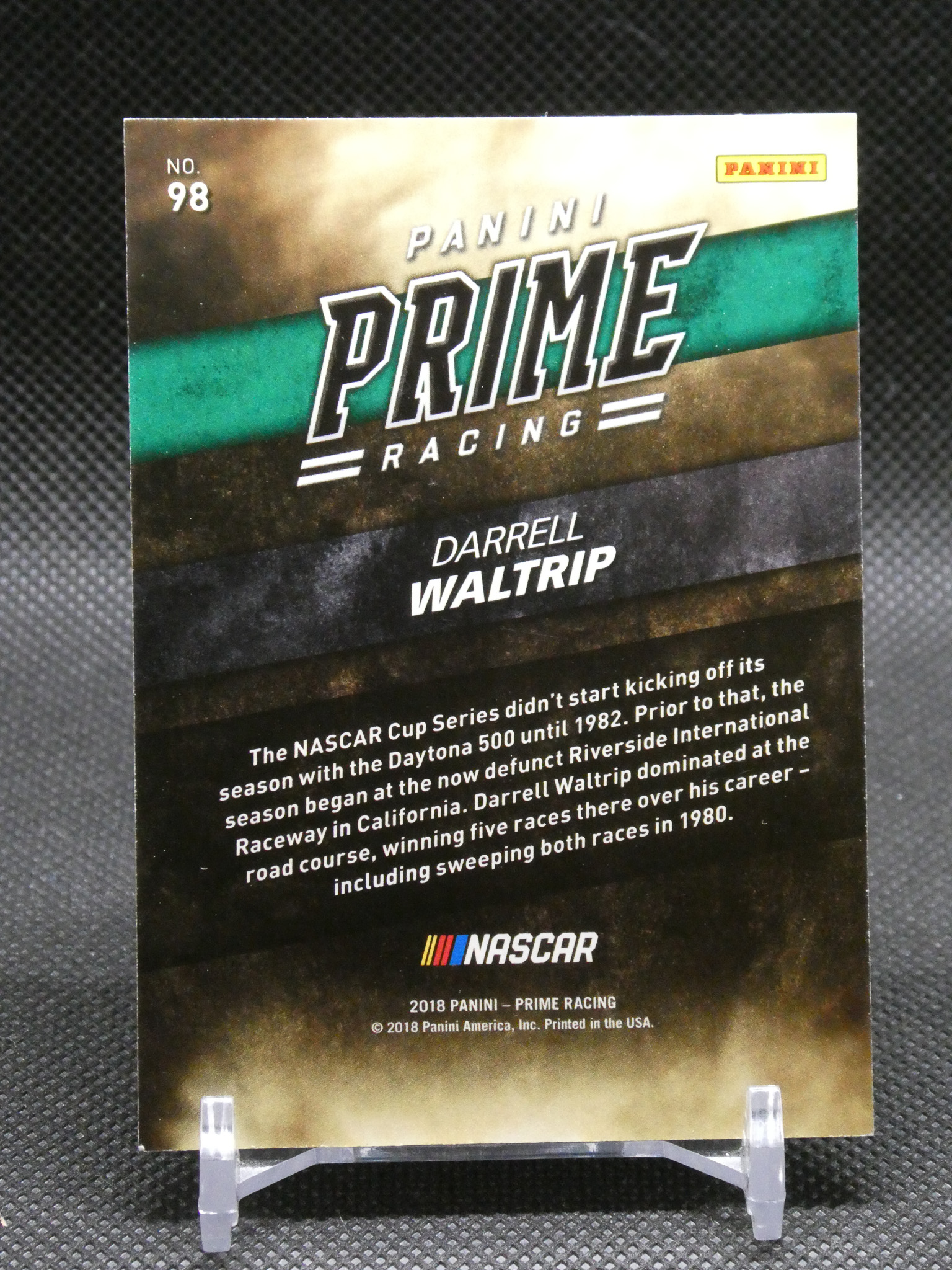 Trading card for Panini Prime Racing featuring Darrell Waltrip (No. 98) with bold 'PRIME RACING' branding and NASCAR text on a dark, striped background.