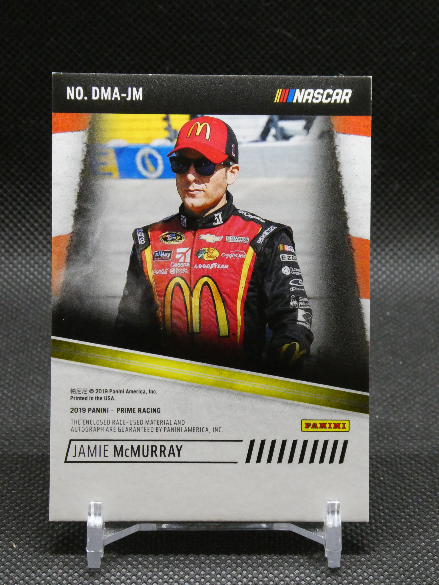 NASCAR trading card featuring Jamie McMurray in a red racing suit with McDonald's logo, top branding shows Panini and NASCAR
