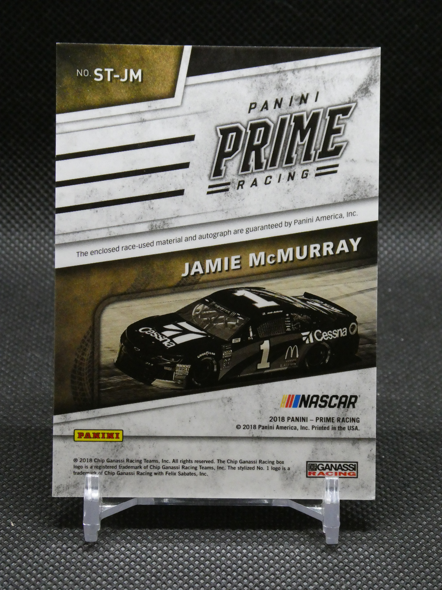 Panini Prime Racing NASCAR trading card featuring driver Jamie McMurray and a black race car graphic on the front.