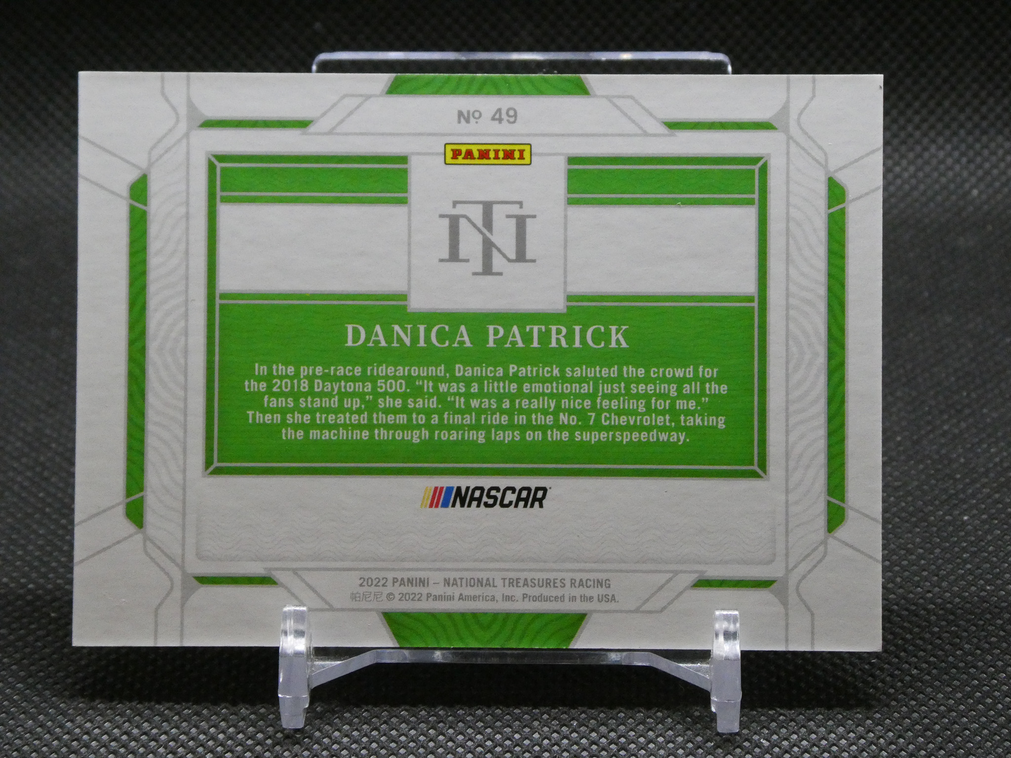 NASCAR Panini trading card back featuring Danica Patrick with a green and white design and the text 'DANICA PATRICK'.