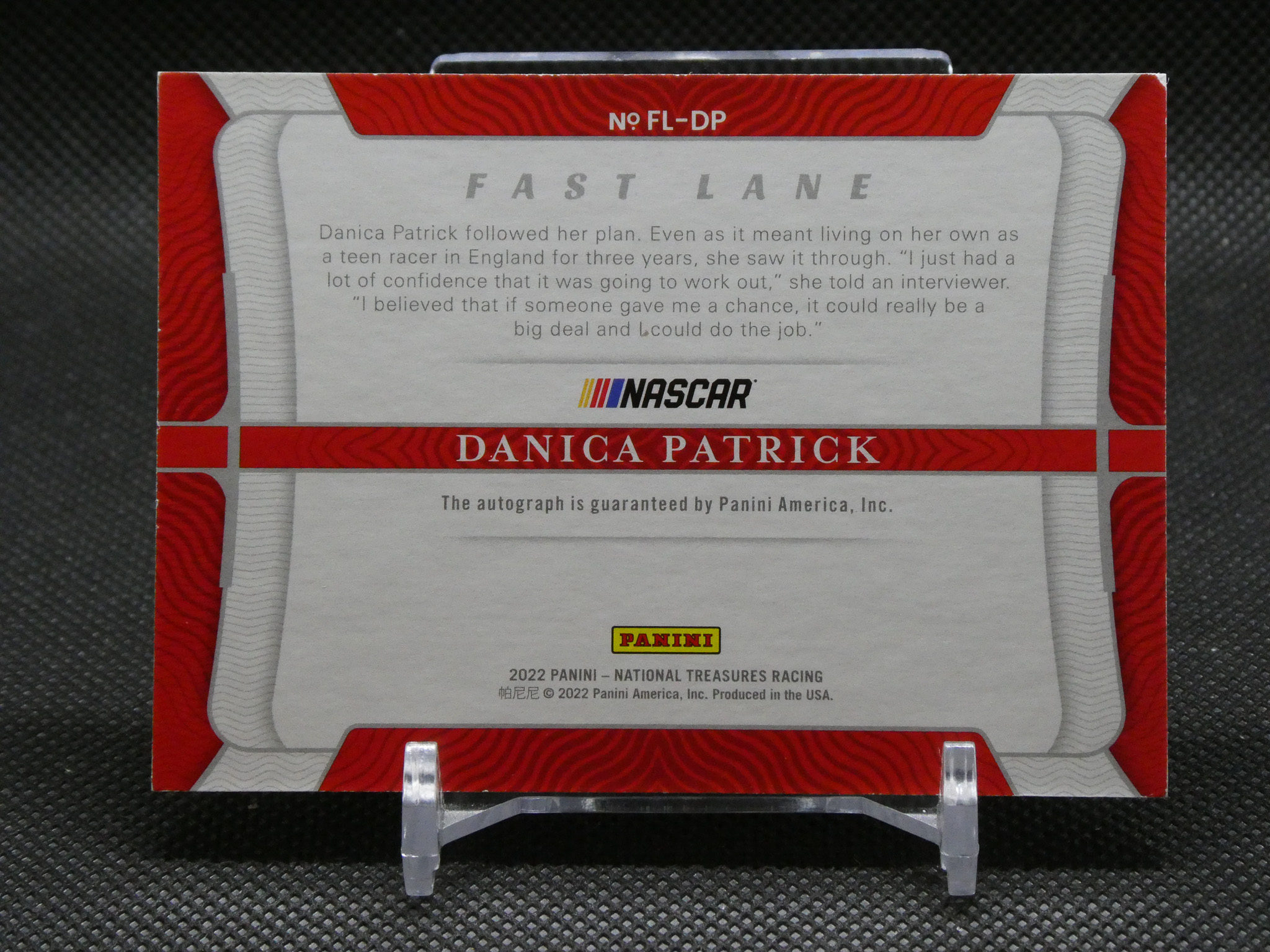 Danica Patrick autographed Panini NASCAR trading card box with red and silver design on a display stand, 2022 National Treasures Racing logo visible.