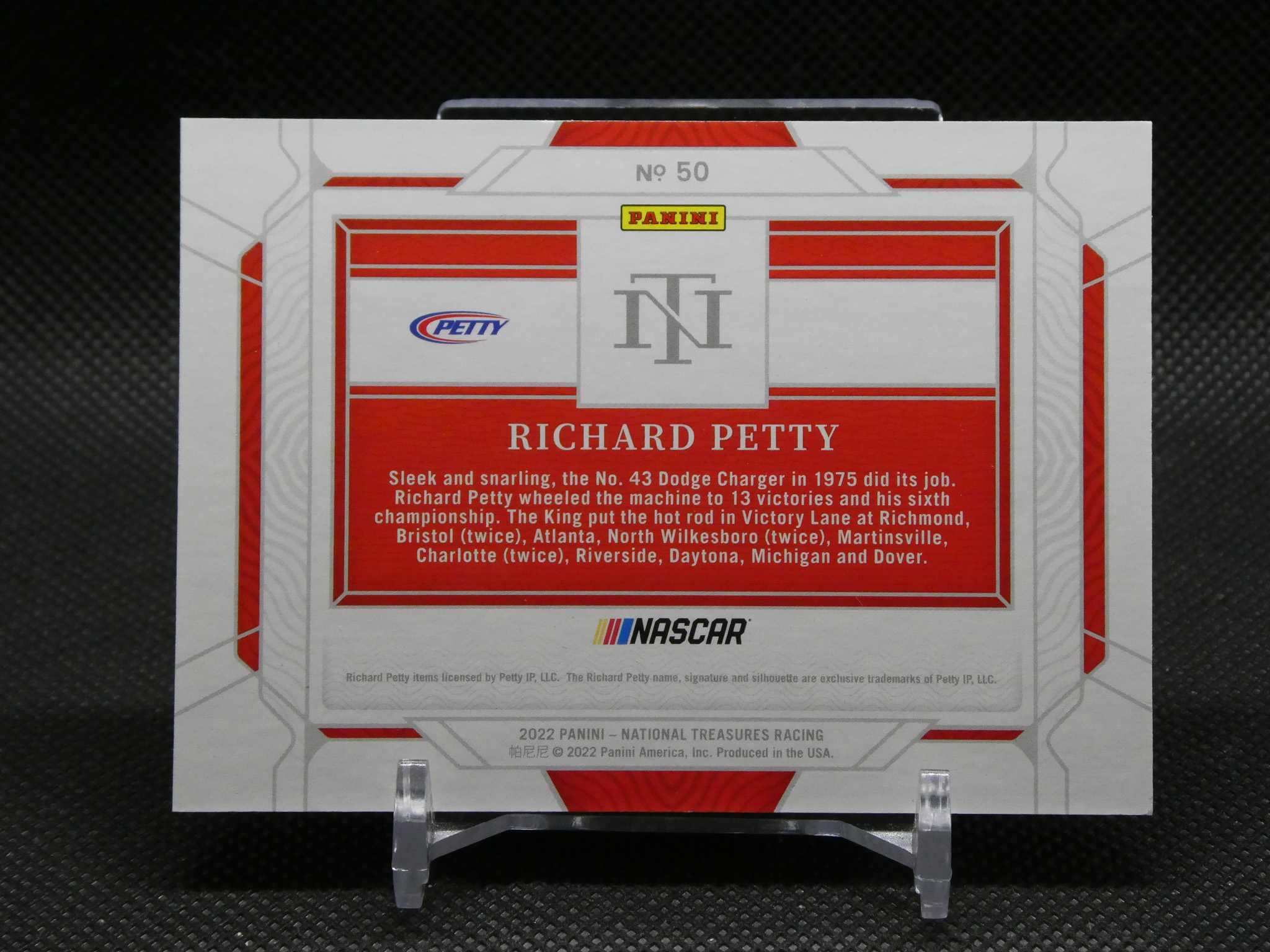 Back of a Panini NASCAR card honoring Richard Petty, red panel with white text and NASCAR logo
