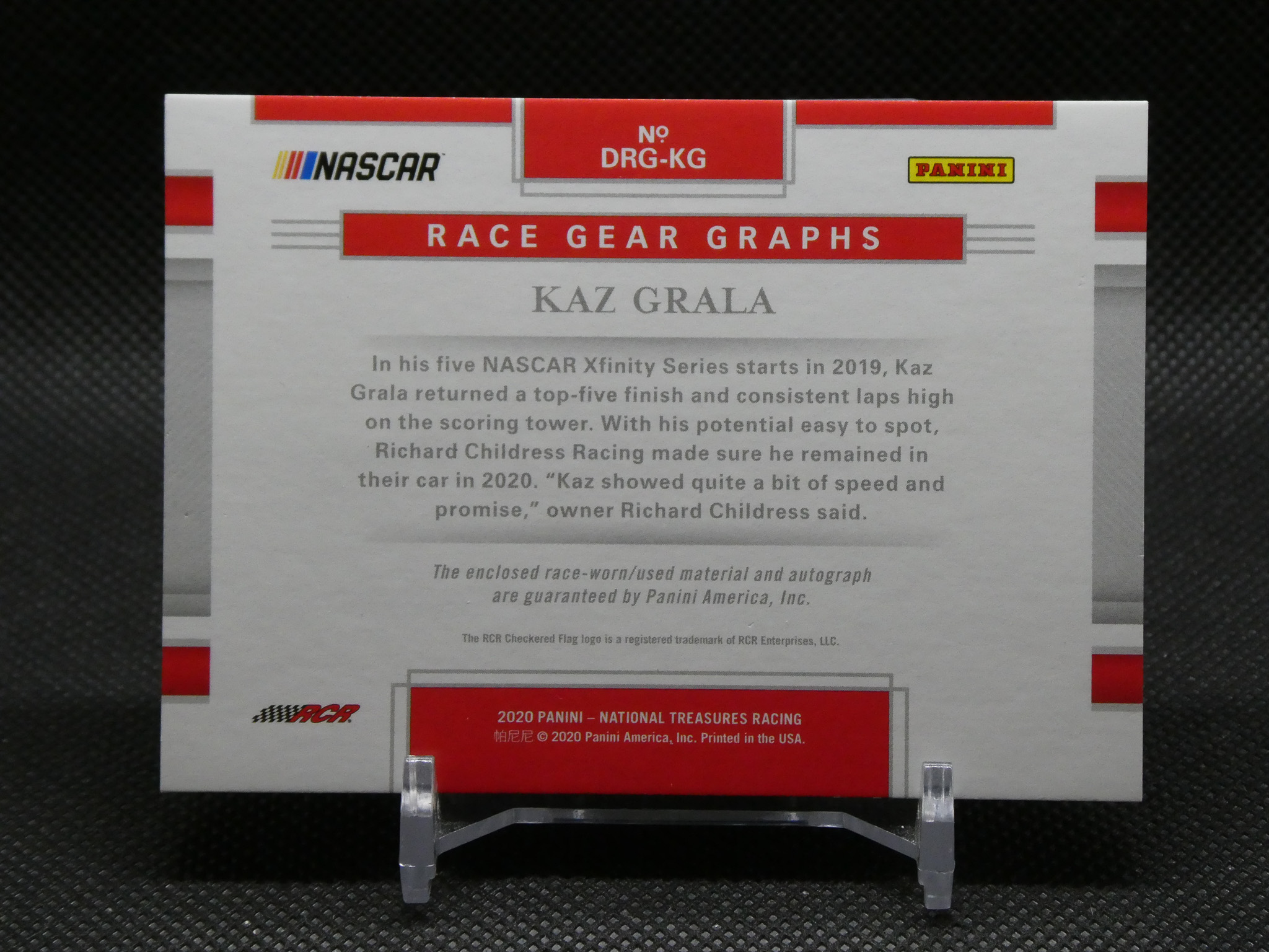 Front of a Panini NASCAR card package for Kaz Grala, featuring a red 'Race Gear Graphs' banner and logos.