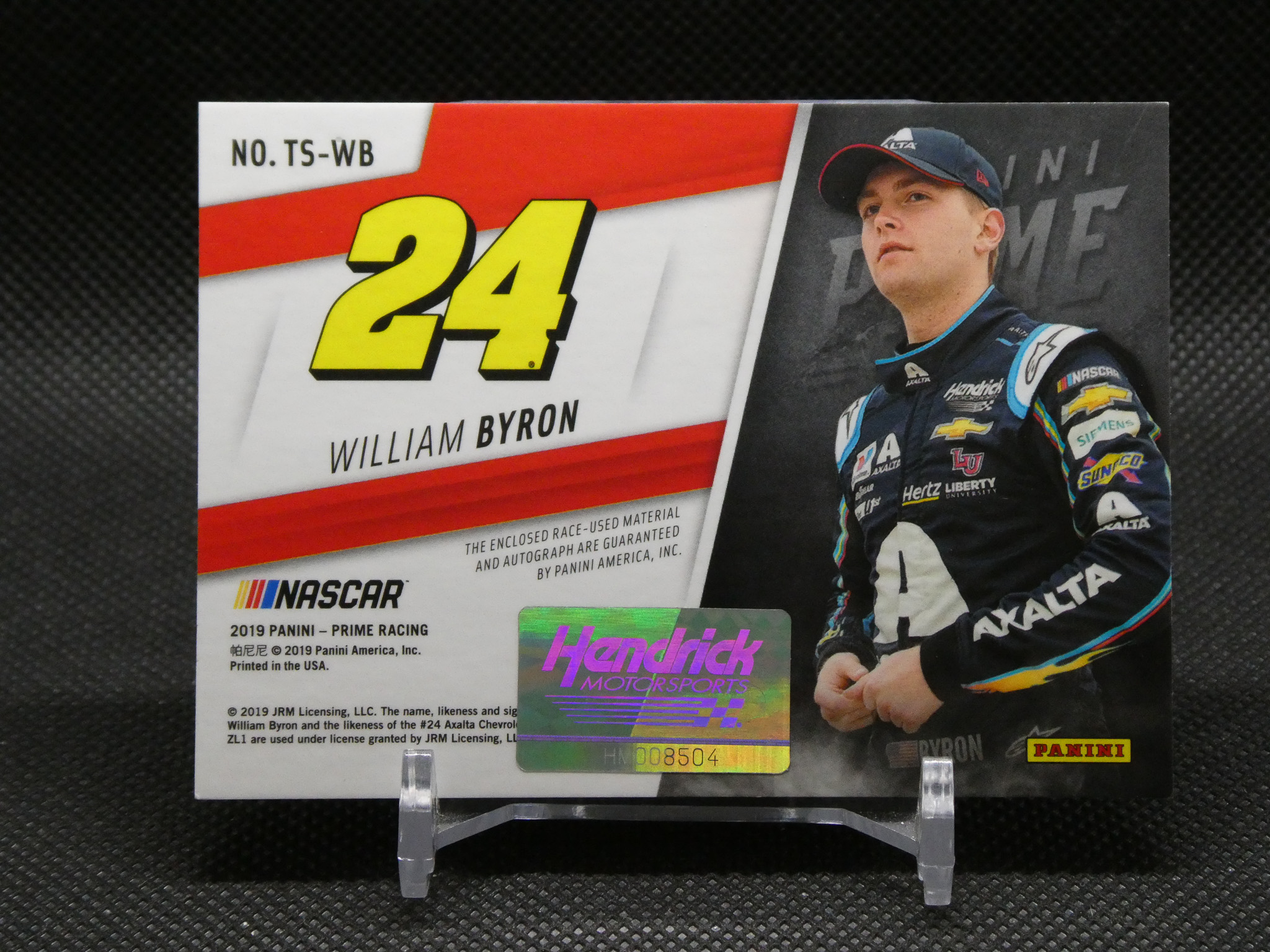 Panini NASCAR trading card featuring William Byron (#24) in a racing suit with sponsor logos and a holographic sticker.