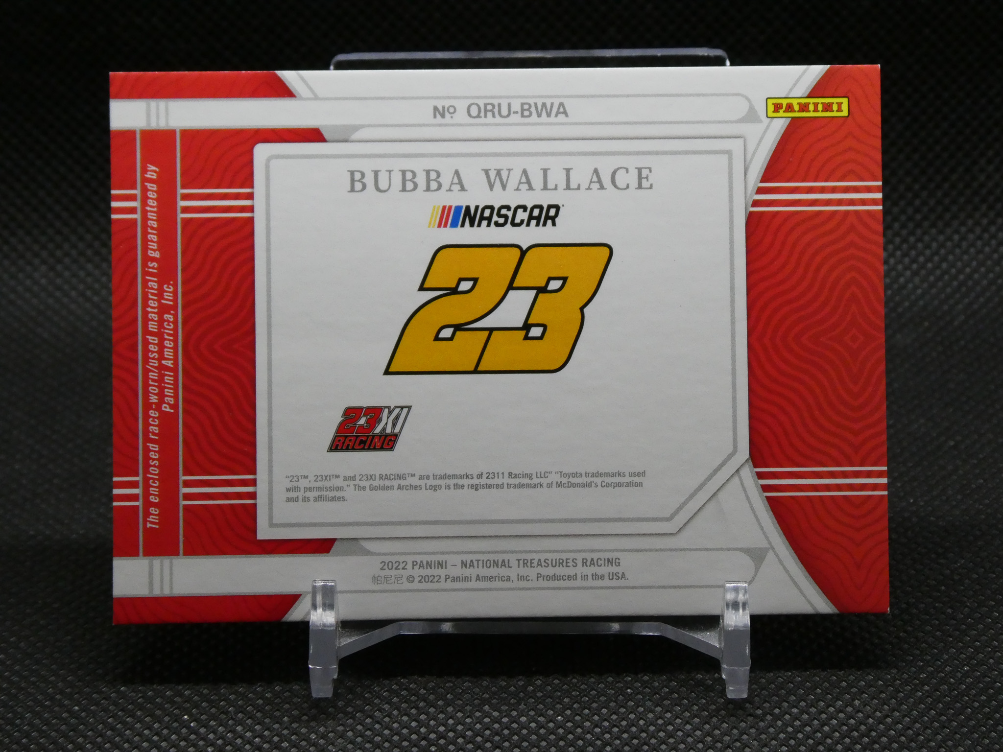 Panini NASCAR box featuring Bubba Wallace and the number 23 logo, red and silver design on a display stand
