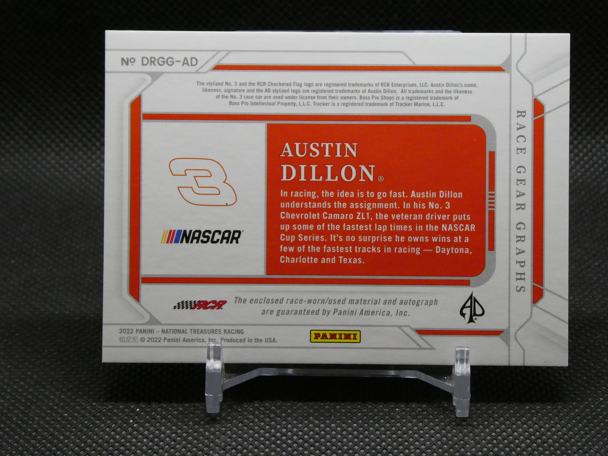 Trading card image featuring Austin Dillon (No. 3) with bold orange panel and NASCAR logo, Panini branding visible.