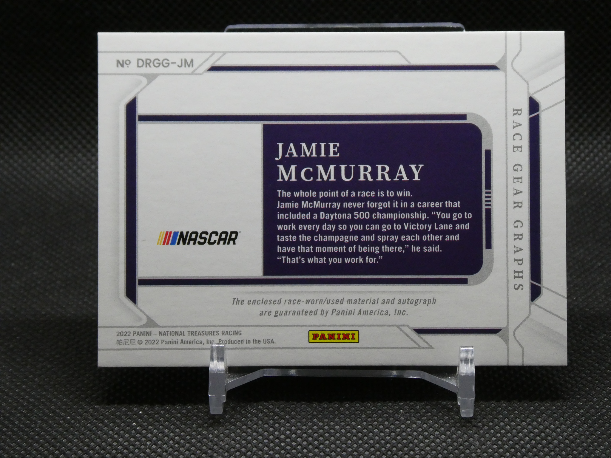 Card-style image featuring Jamie McMurray NASCAR autograph with team wording and Panini logo on a light gray background.