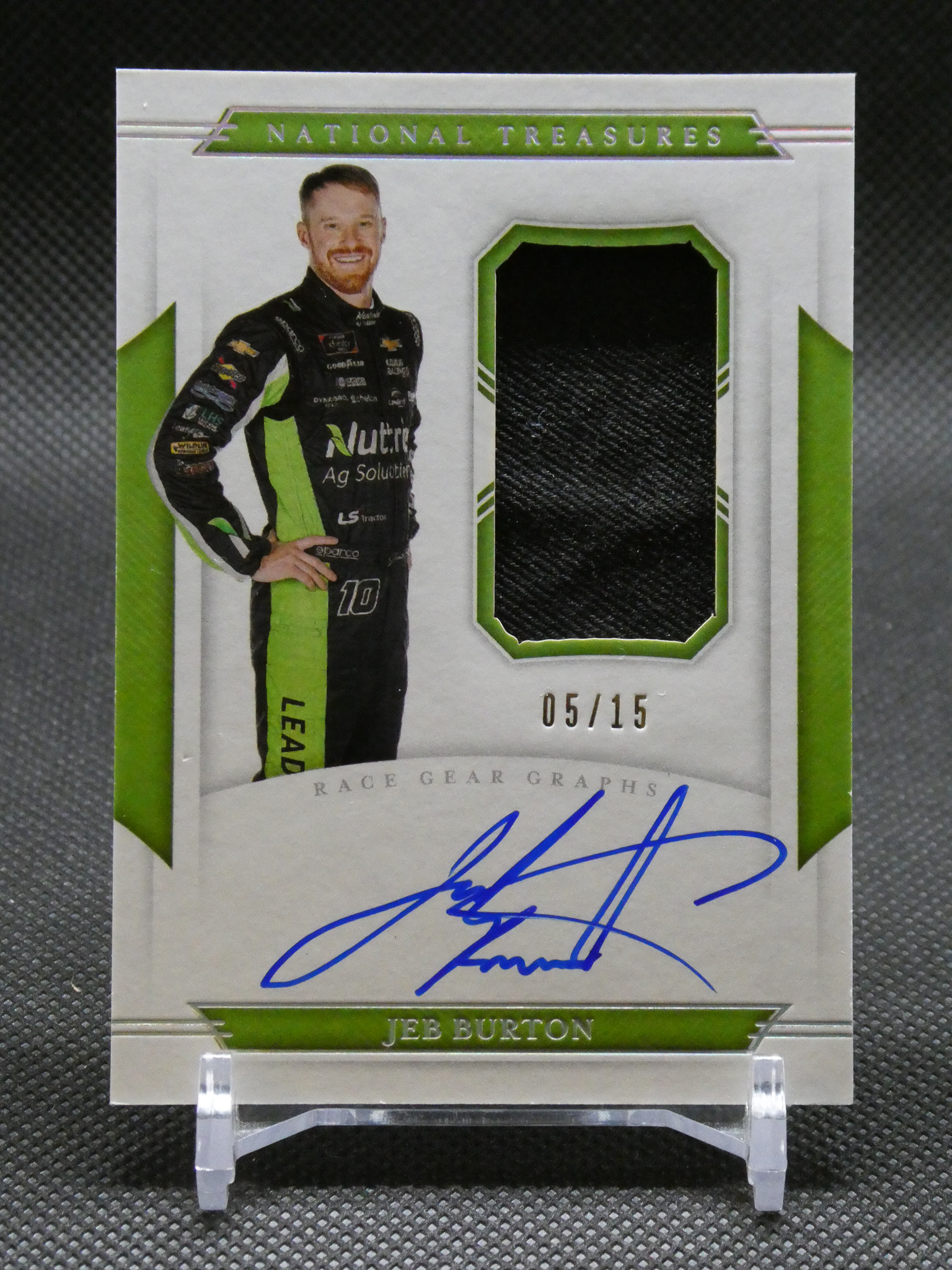 Jeb Burton National Treasures trading card with driver photo, green patch window, and blue autograph.