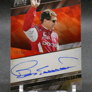 Autographed Panini Prime NASCAR card of Bill Elliott, shown in a red racing suit with sunglasses, waving his hand on a red background, on a display stand.