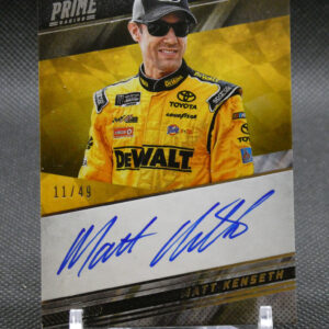 Autographed racing trading card of Matt Kenseth in a yellow DeWalt suit with cap and sunglasses; includes 11/49 edition and blue signature at bottom.