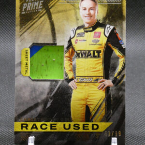 Panini Prime Racing card featuring a smiling driver in a yellow DeWalt racing suit with a 'Race Used' banner at the bottom.