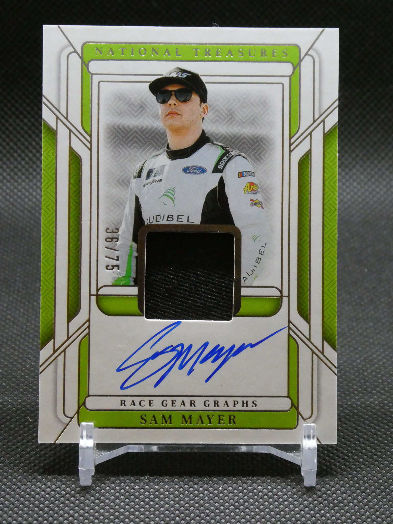 Autographed trading card featuring Sam Mayer in a white racing suit with green accents, portrait framed by a green-bordered design that says National Treasures.