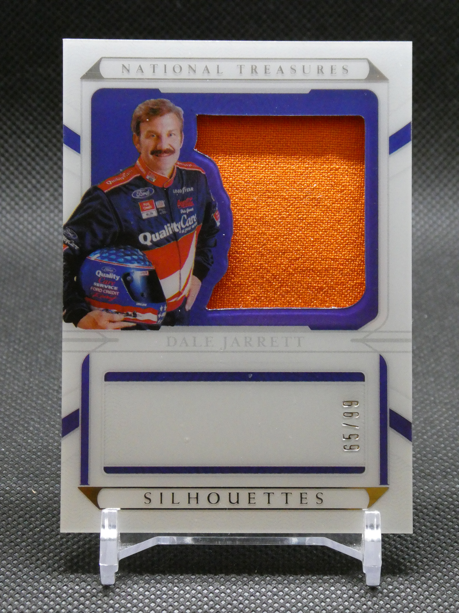 Trading card featuring NASCAR driver Dale Jarrett with an orange fabric swatch