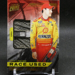 Trading card featuring NASCAR driver Joey Logano in a yellow Pennzoil racing suit with 'RACE USED' label at bottom.