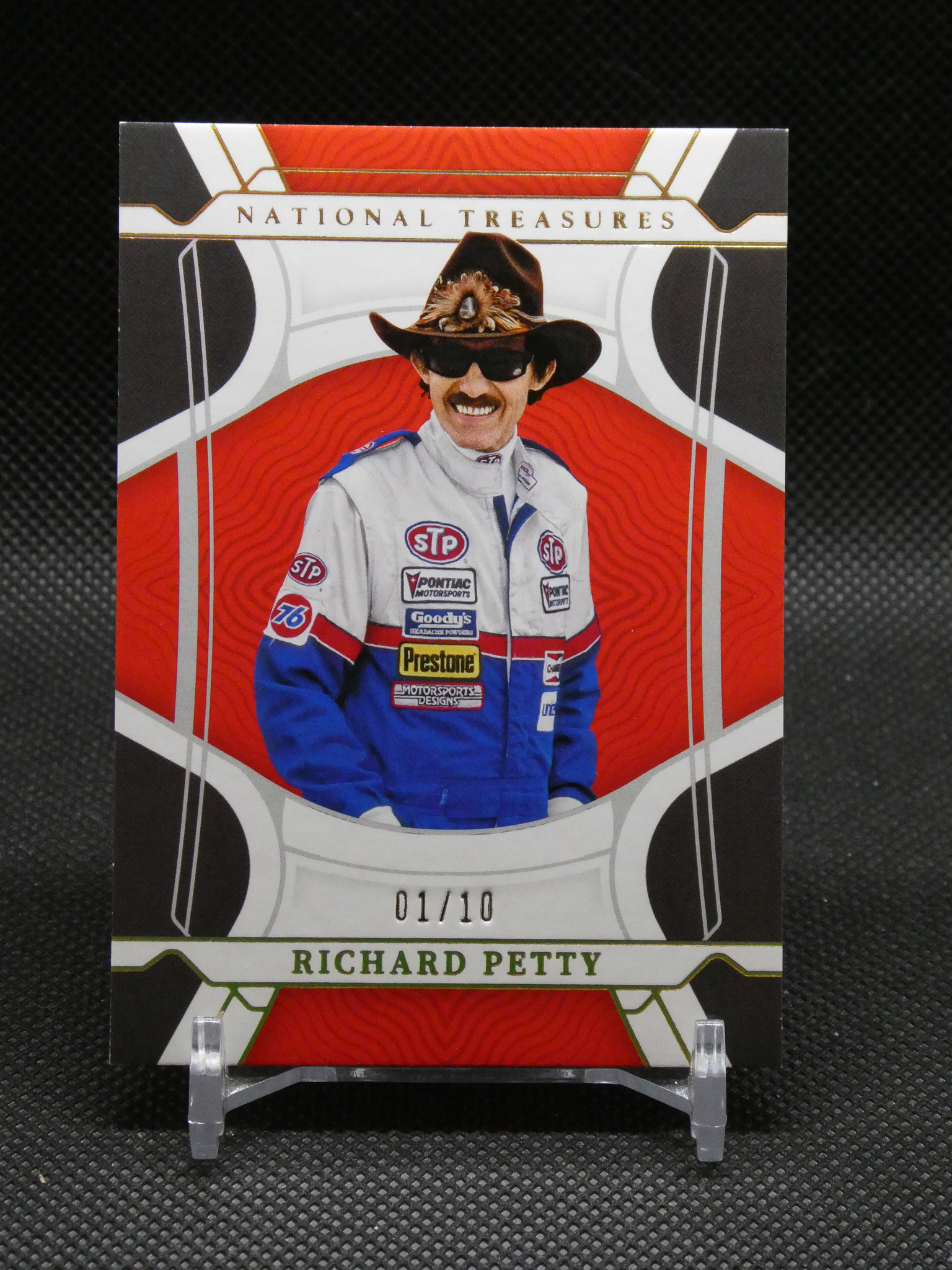 Richard Petty National Treasures trading card featuring Petty in a white racing suit with a cowboy hat, 01/10 printed at bottom