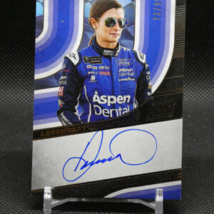 Autographed poster of a female race car driver in a blue Aspen Dental suit, wearing mirrored sunglasses, posed in front of a blue background.