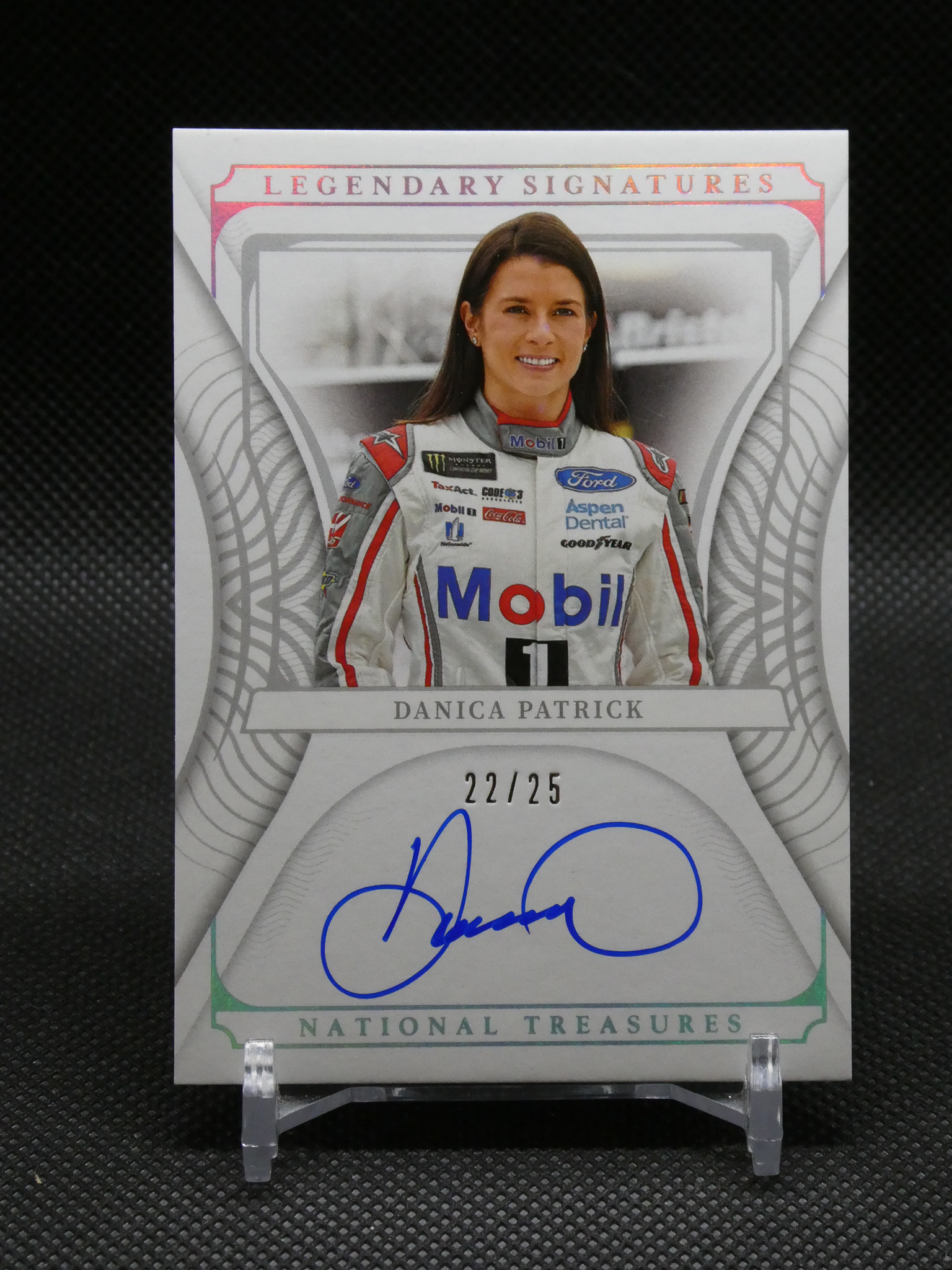 National Treasures trading card of Danica Patrick, showing her in a racing suit with sponsor logos, labeled Legendary Signatures and numbered 22/25.