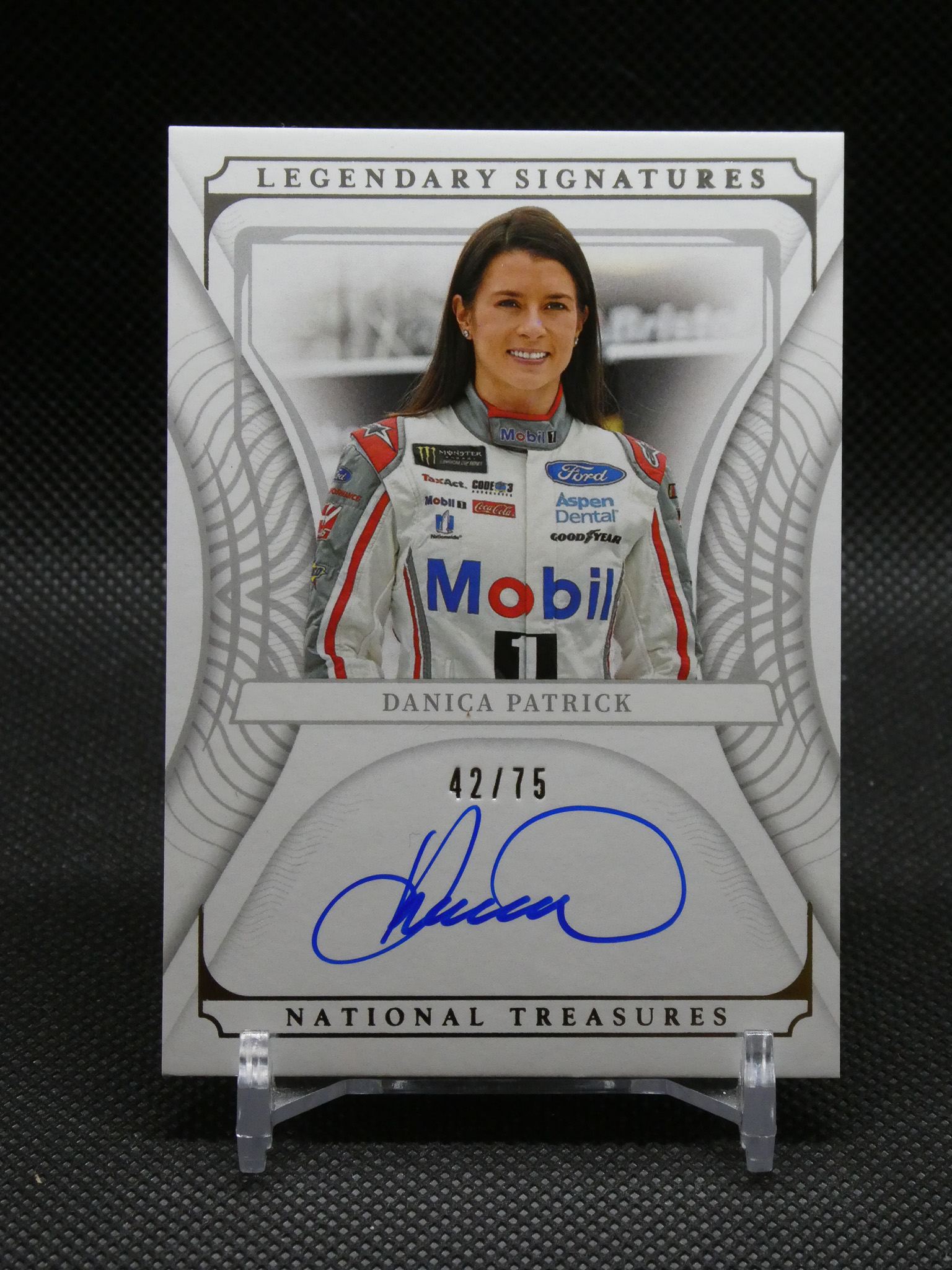Autographed racing card featuring Danica Patrick in a Mobil Lara racing suit with 'Legendary Signatures' header and 'National Treasures' branding, 42/75 edition.