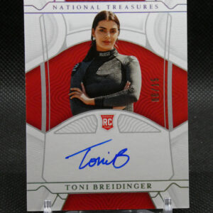 Front of a National Treasures rookie card featuring Toni Breidinger in a dark racing suit, with a blue autograph across the lower area.