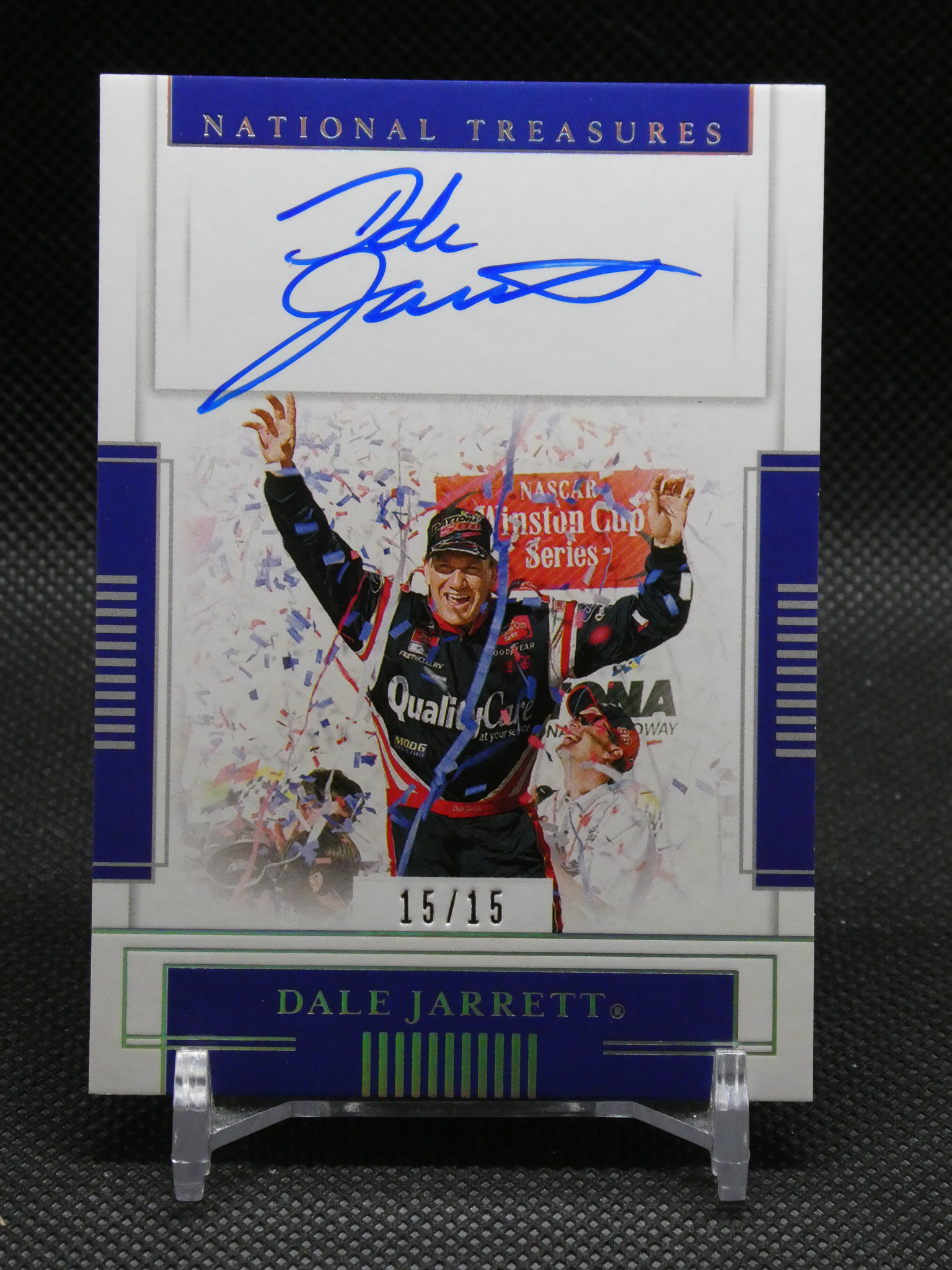 Autographed Dale Jarrett National Treasures card with a blue signature and 15/15 edition marking, confetti in the background