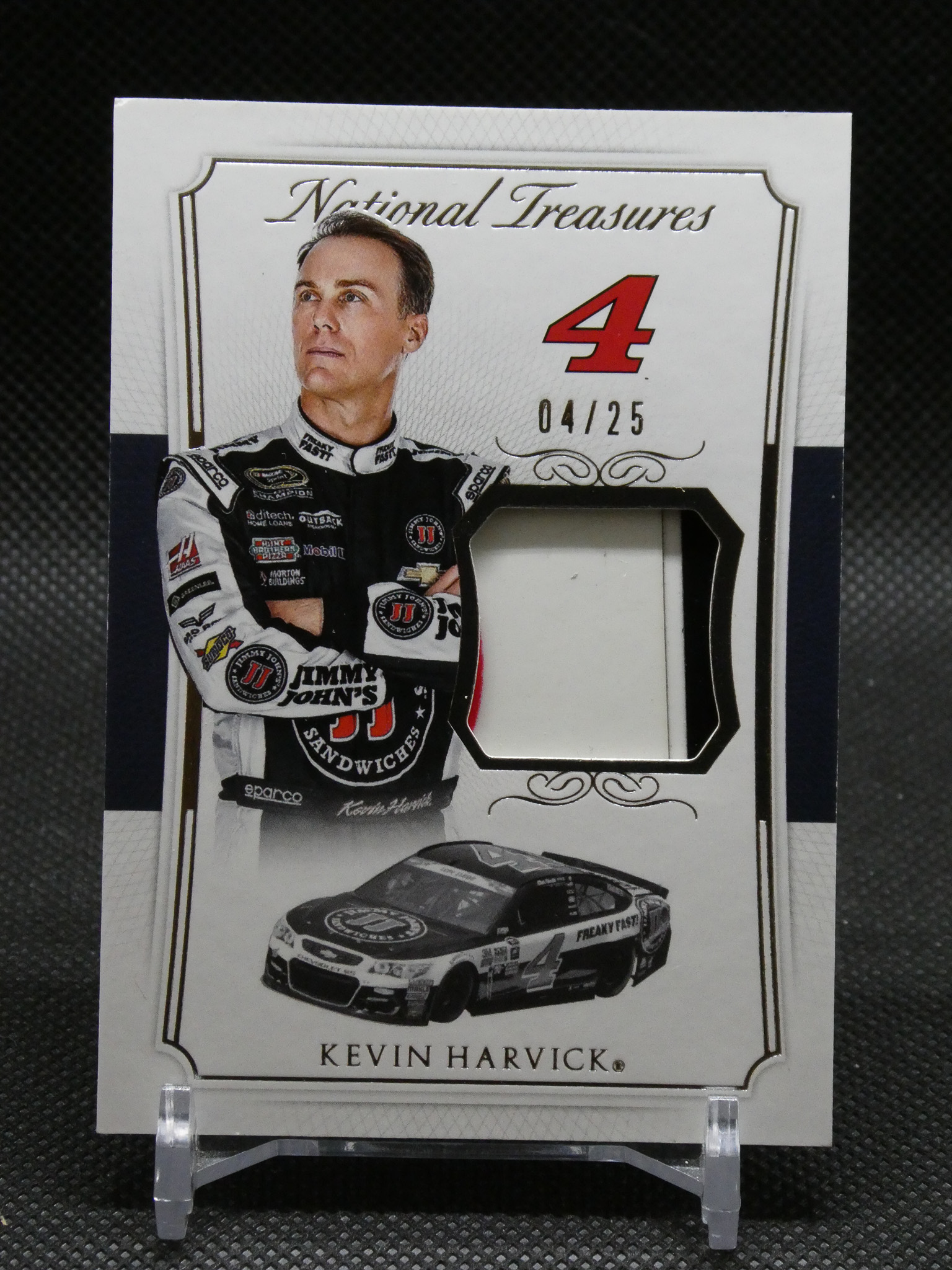Kevin Harvick National Treasures trading card with his portrait, large red number 4, and a race car image at the bottom, framed in ornate border.