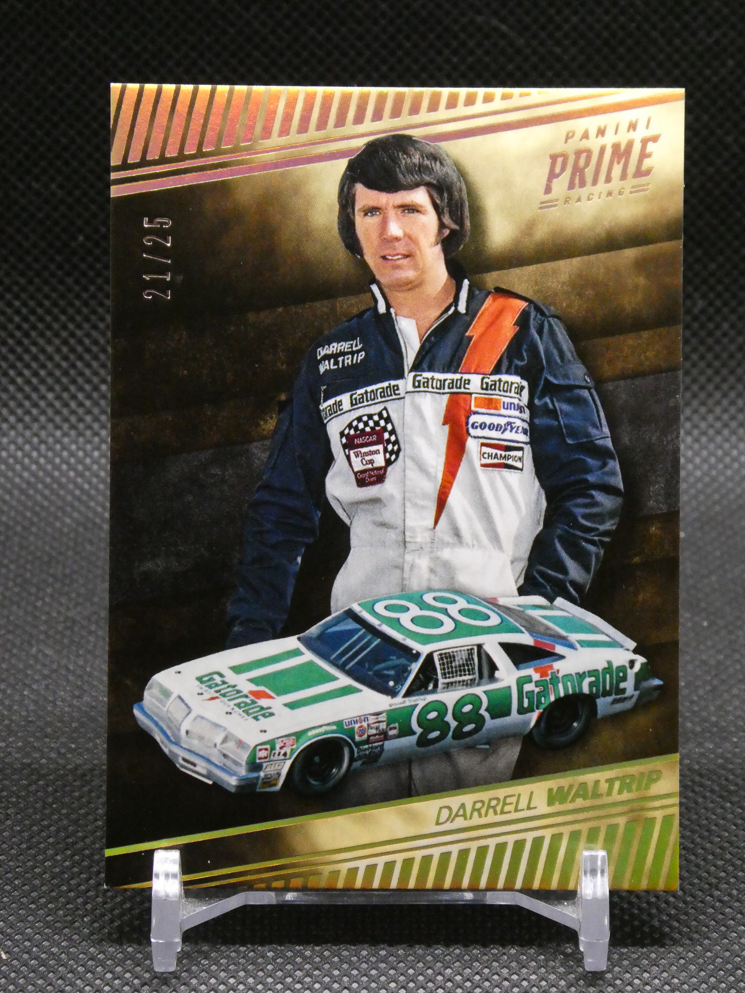 Trading card image of Darrell Waltrip in a racing suit with the No. 88 Gatorade car on the card backdrop, Panini Prime Racing logo visible.
