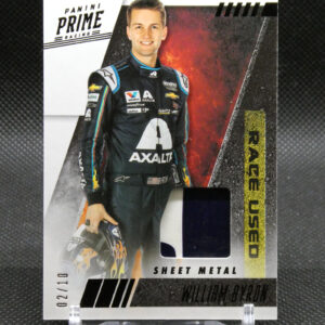 Panini Prime Racing trading card featuring driver William Byron in a black Axalta suit, holding his helmet on a display stand.