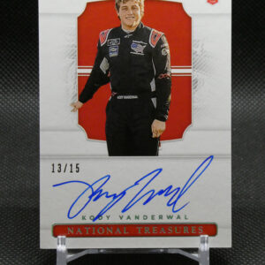 Signed trading card featuring a race car driver in a black racing suit, standing in front of a red backdrop; edition 13/15, National Treasures branding visible at the bottom.