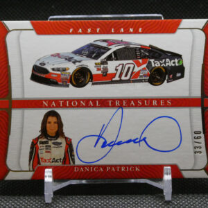 Autographed Danica Patrick trading card display with a signed photo and a race car image above it.