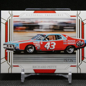 NASCAR race car model packaging showing a red and blue car with the number 43 and STP logos behind a clear window.