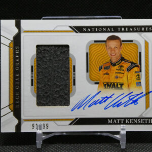 Autographed Matt Kenseth NASCAR card with blue signature, featuring a black fabric swatch and printed portrait on a white card labeled National Treasures