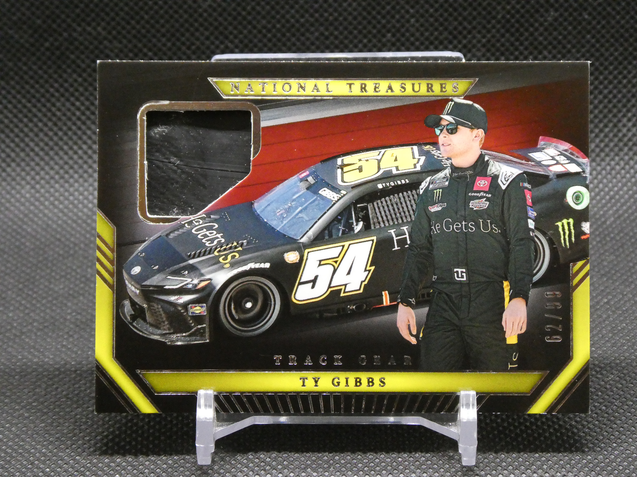 Box cover for a Ty Gibbs NASCAR trading card set, featuring a racing car and the 'National Treasures' banner at the top.