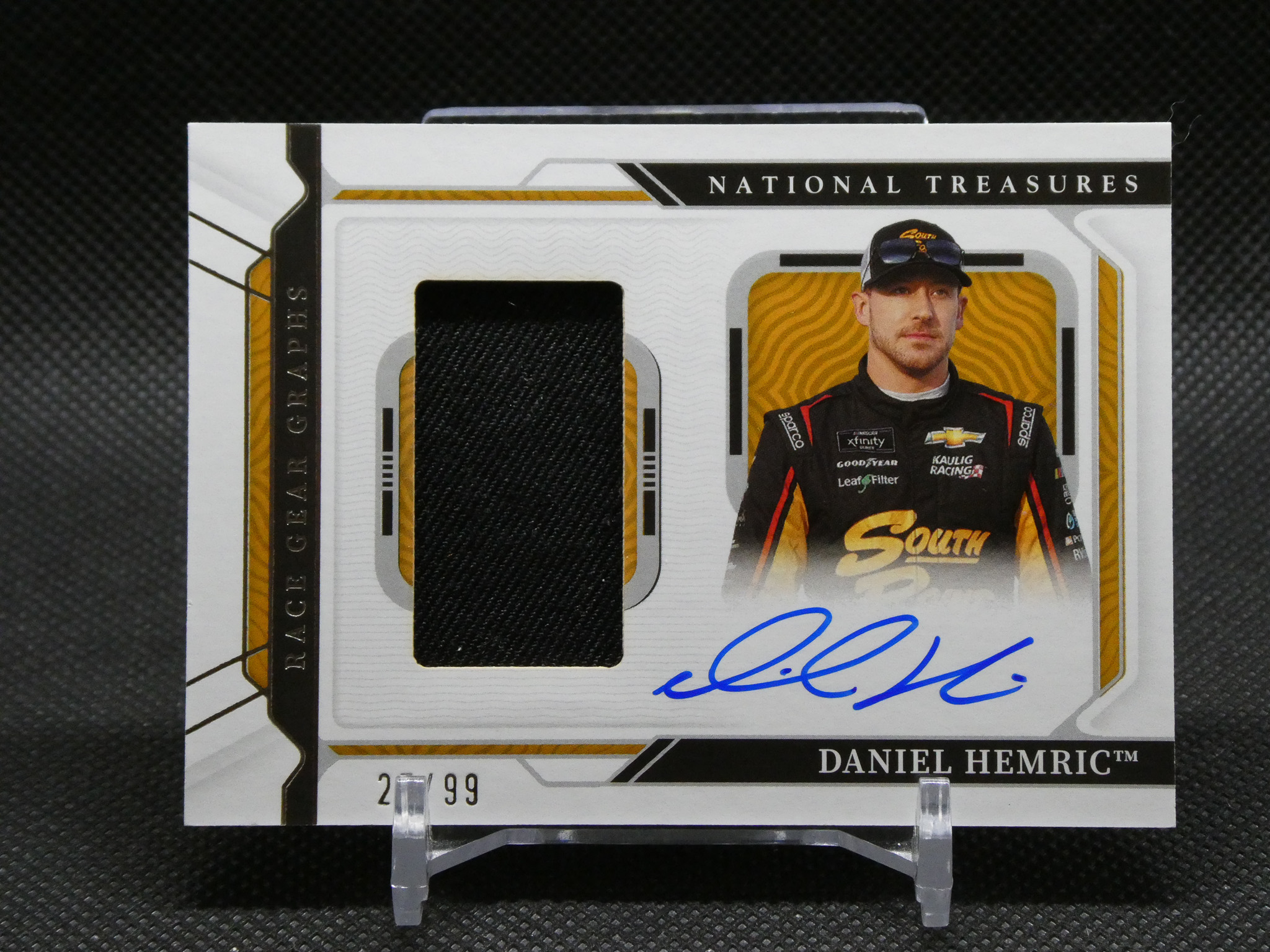 Daniel Hemric trading card with his portrait, autograph in blue, and National Treasures branding visible.