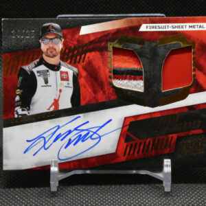 Autographed sports trading card featuring a race car driver in a firesuit, red flame background, and a blue signature across a white area.