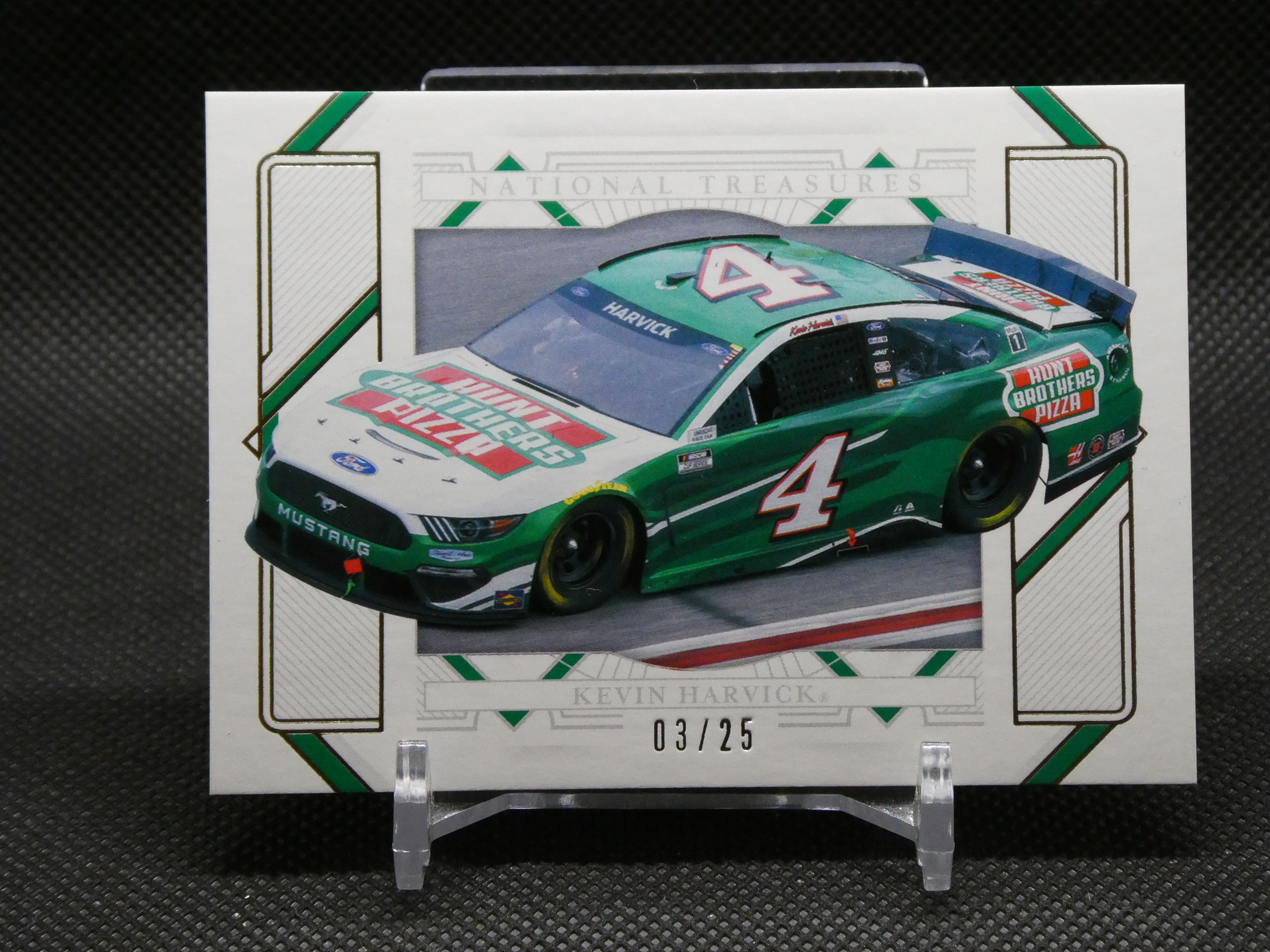 NASCAR collectible card featuring Kevin Harvick's green no. 4 car inside a decorative frame with sponsor logos and edition marks (03/25).