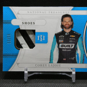Front of a sealed box featuring NASCAR driver Corey LaJoie in a blue racing suit, with 'National Treasures' branding and his name at the bottom.